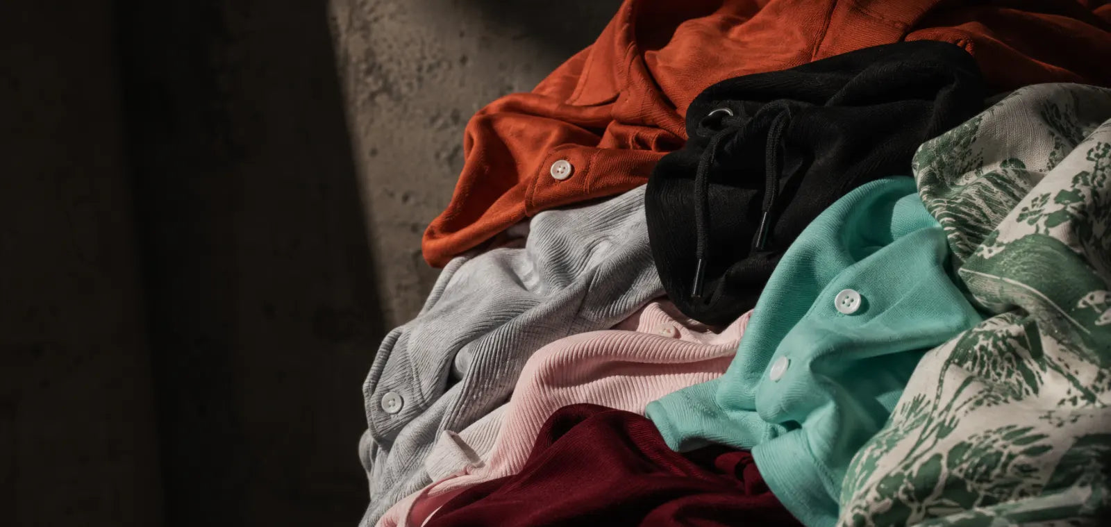 Folded fabric bolts and swatches beside a scale